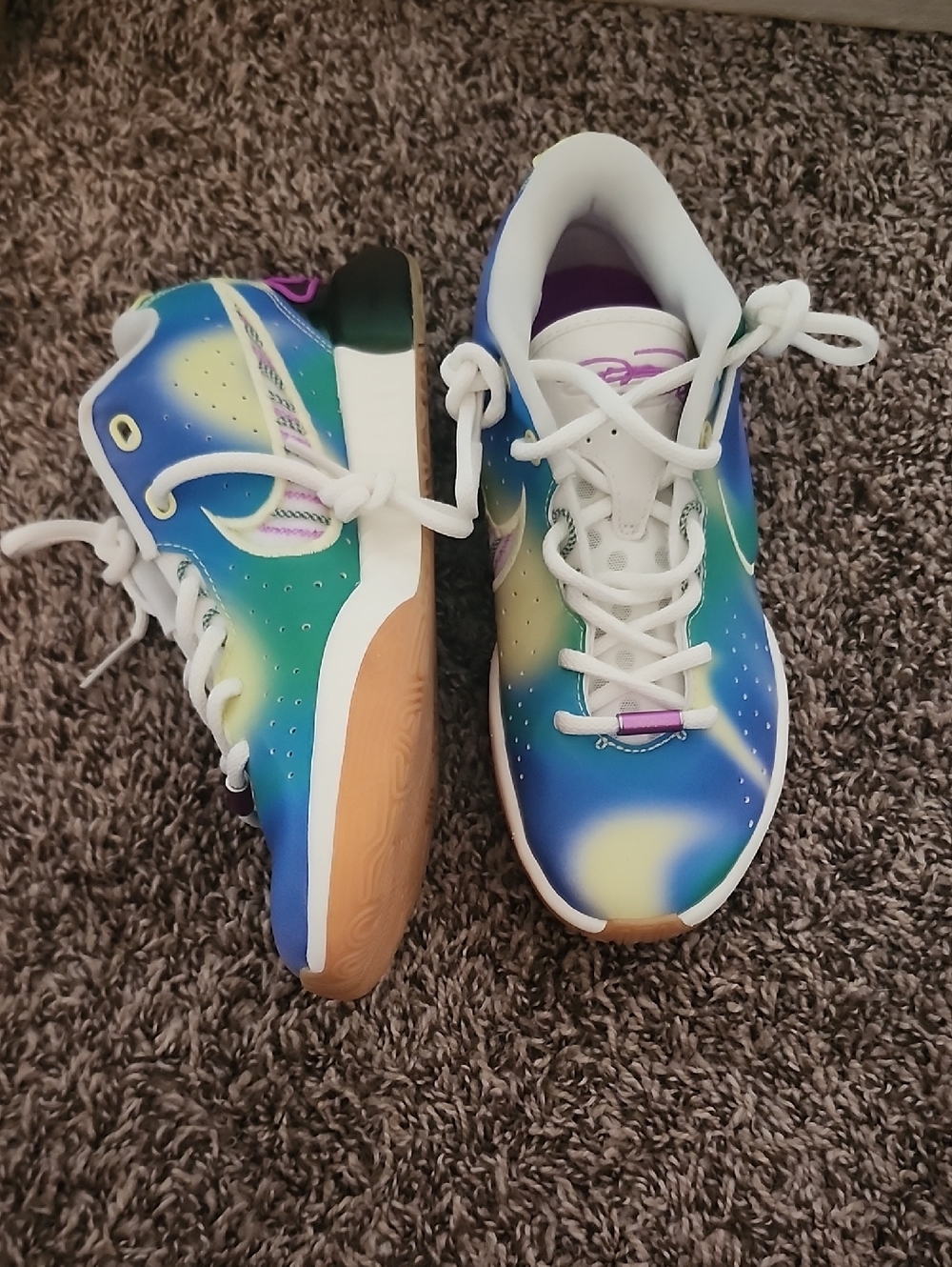 These are Nike LeBron XXI SE grade school sneakers in a multicolor "Movie Night"